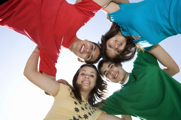 Friends Forming A Huddle Against Sky — Stock Photo, Image