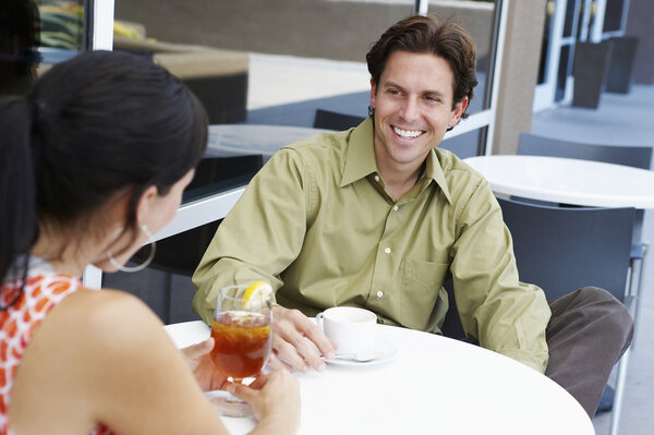 Man Enjoying Coffee Date With Woman