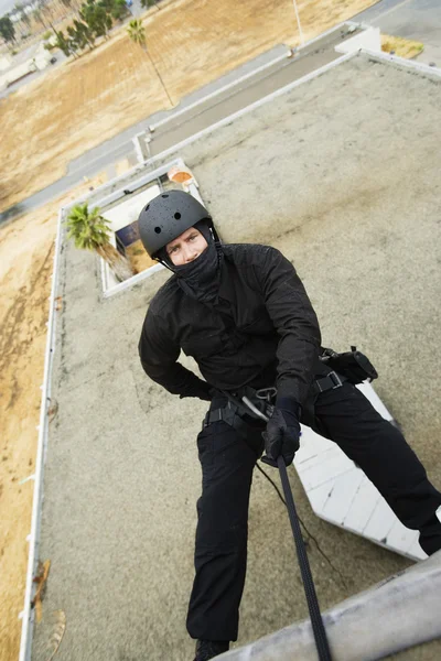 SWAT Team Officer Rappelling from Building — Stock Photo, Image