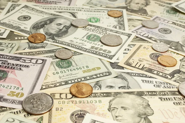 depositphotos_21863811-stock-photo-coins-on-dollar-bills.jpg