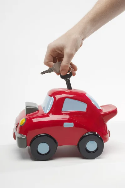 Closeup Of Hand Inserting Keys In Toy Car — Stock Photo, Image
