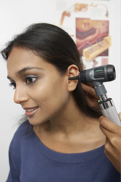 Doctor's Hand Checking Patient's Ear — Stock Photo, Image