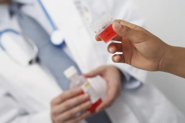 Boy Holding Medicine In Liquid Measure — Stock Photo, Image