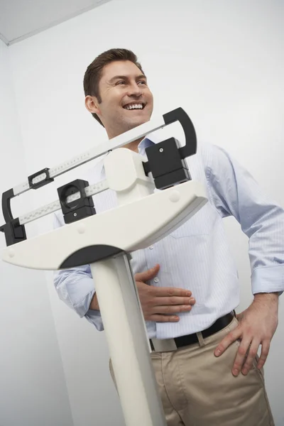 Happy Man Measuring Weight On Weighing Scale — Stock Photo, Image