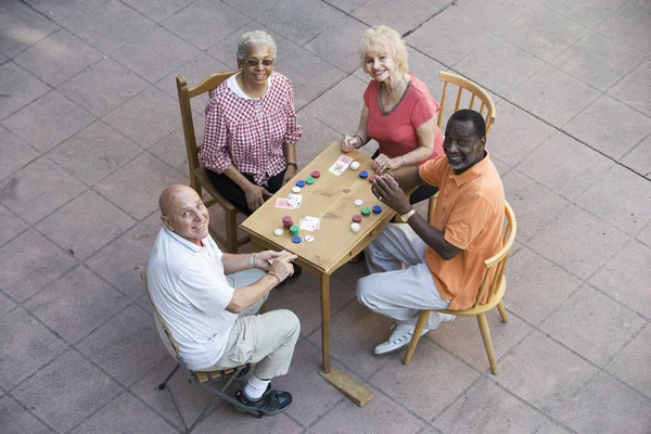 Senior people playing cards — Stock Photo, Image