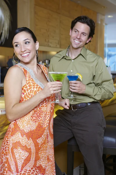 Cheerful Couple Drinking Martinis Royalty Free Stock Images