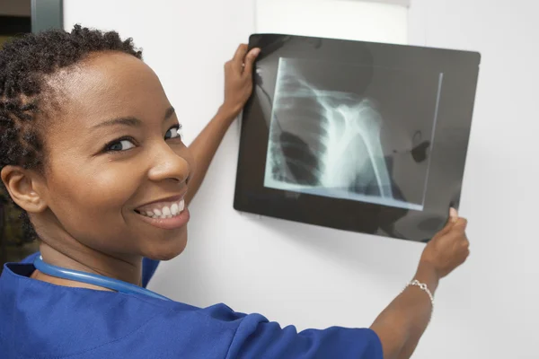 Happy Doctor Holding X-Ray Report — Stock Photo, Image