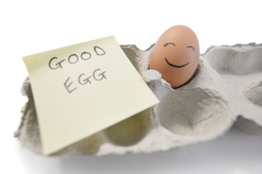 Happy egg with a note written 'good egg'