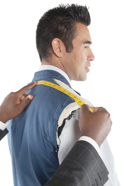 Profile view of man getting measured by tailor — Stock Photo, Image