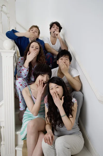 Group portrait of young friends yawning — Stock Photo, Image