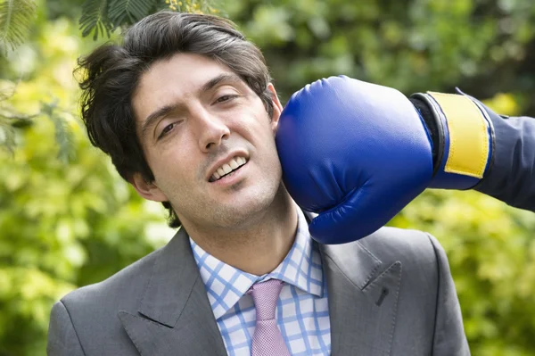 Young man getting hit — Stock Photo, Image