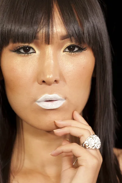 Portrait of young woman wearing beautiful ring with white lipstick — Stock Photo, Image