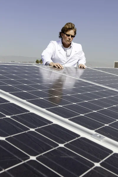 Man with solar power panel — Stock Photo, Image