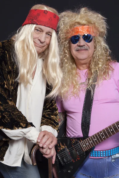 Portrait of smiling musicians over black background — Stock Photo, Image