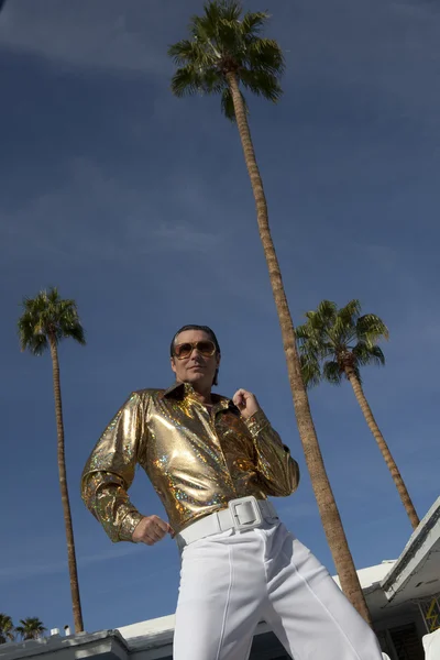 Low angle view of middle-aged man impersonating Elvis Presley — Stock Photo, Image