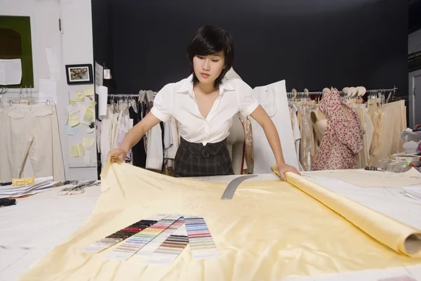 Fashion designer working at desk — Stock Photo, Image