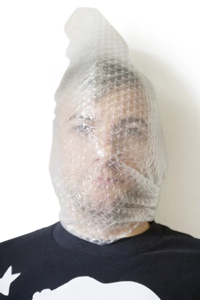 Portrait of man wrapped in bubble wrap — Stock Photo, Image