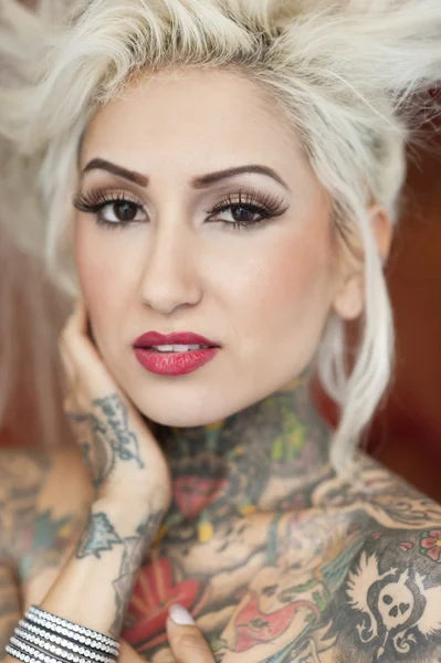 Portrait of blond woman with tattoos — Stock Photo, Image