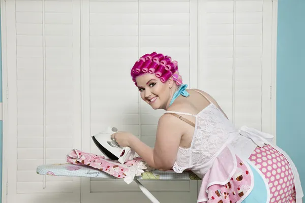 Happy curvy woman ironing — Stock Photo, Image