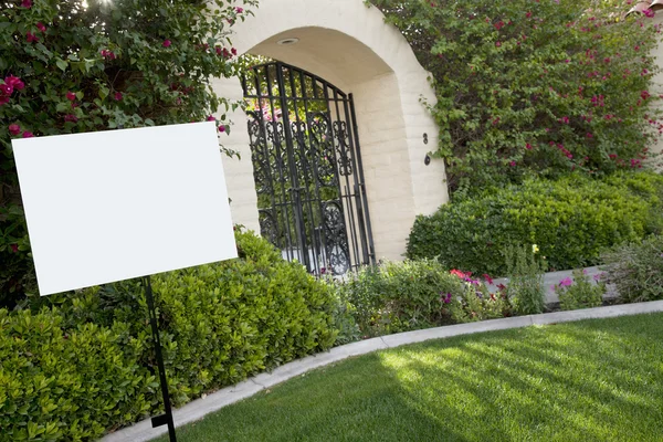 Sign board on lawn with house in background — Stock Photo, Image