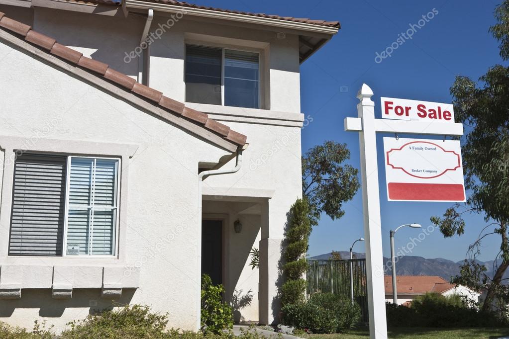 House With 'For Sale' Sign
