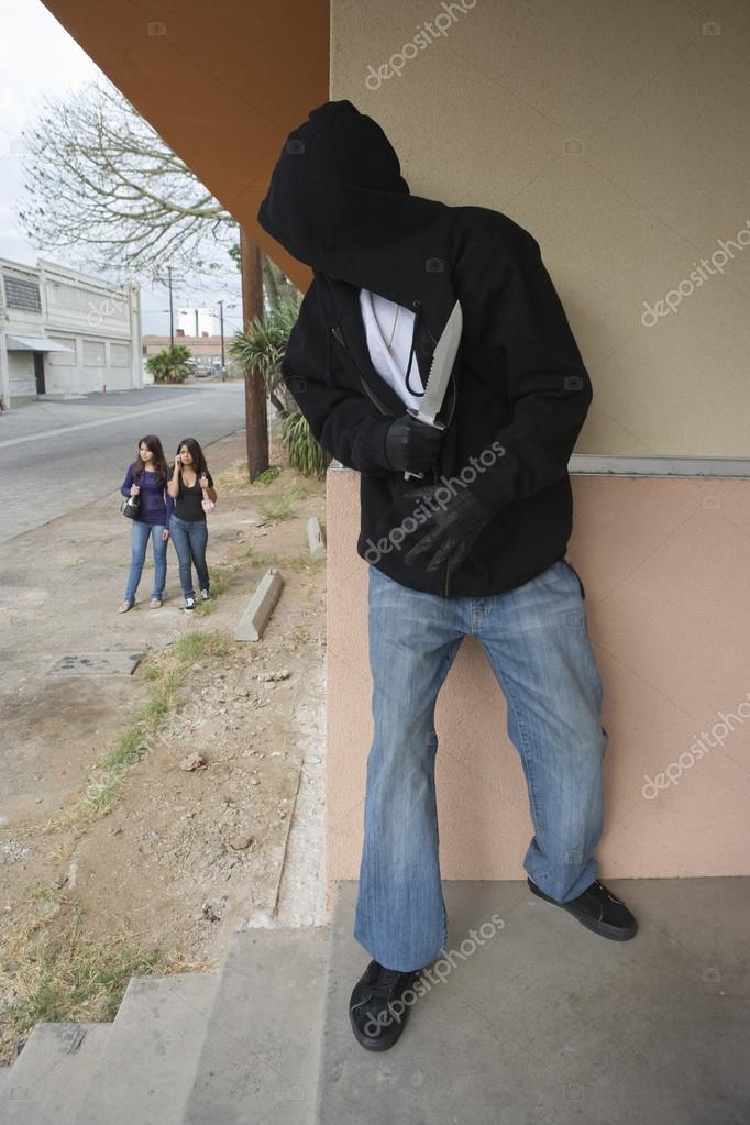 Women Hiding Behind Wall