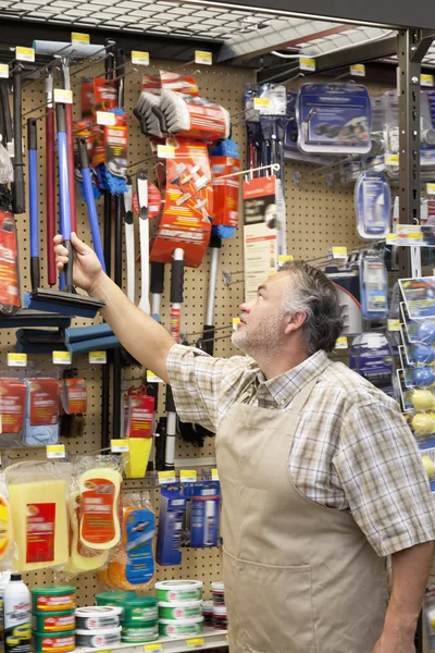 Mature  salesman in hardware store — Stock Photo, Image