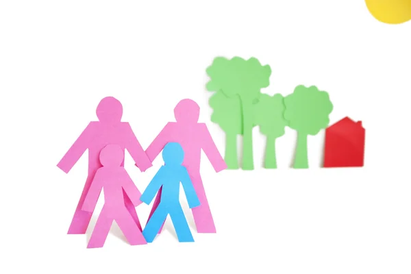 Paper cut outs representing a family with trees and house over white background — Stock Photo, Image