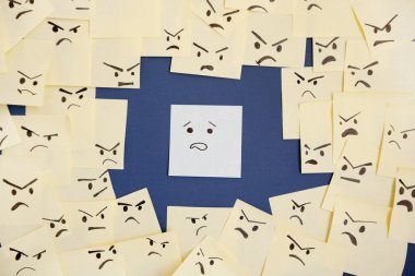 Sticky notes with anthropomorphic face blaming colleague clipart