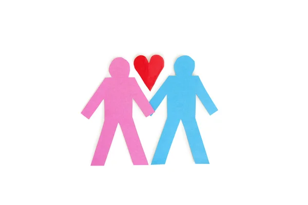 Two stick figures holding hands with a red paper heart over white background — Stock Photo, Image