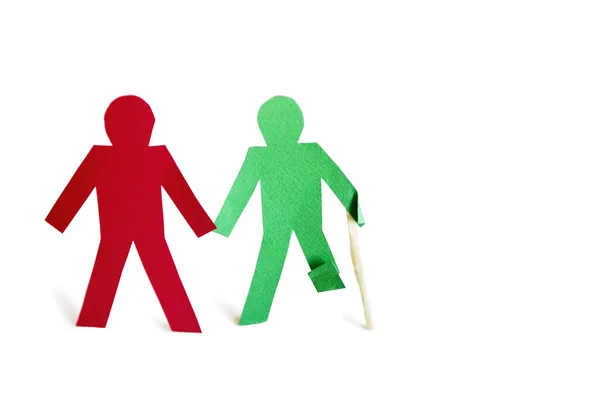 Two stick figures holding hands one with an injury over white background — Stock Photo, Image