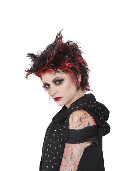 Portrait of punk woman showing attitude over white background — Stock Photo, Image