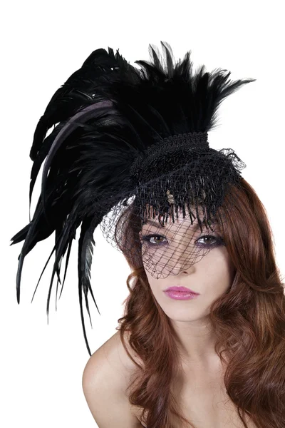 Portrait of young brunette wearing feathered veil over white background — Stock Photo, Image