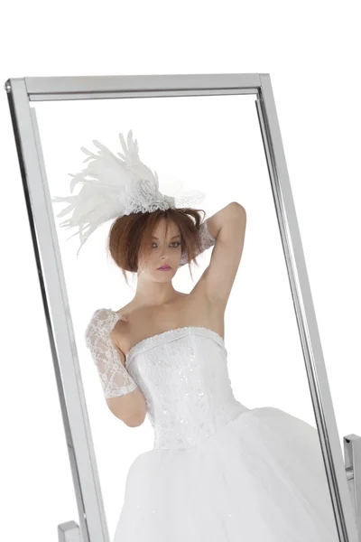 Reflection of young bride in mirror over white background — Stock Photo, Image