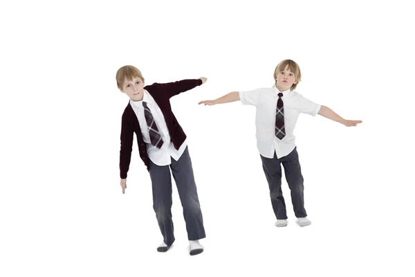 Boys with arms outstretched over white background — Stock Photo, Image