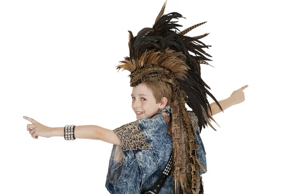 Portrait of boy in costume with headdress looking back over white background — Stock Photo, Image