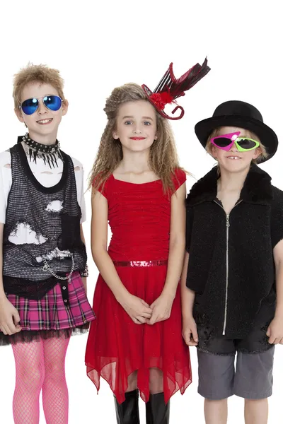 Portrait of school children wearing fancy dress outfits over white background — Stock Photo, Image