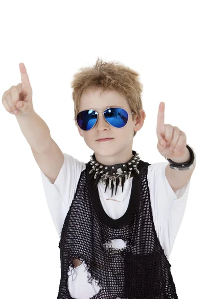 Portrait of punk kid pointing with arms raised over white background — Stock Photo, Image