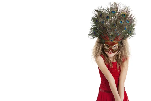 Portrait of a happy girl wearing peacock feather mask over white background — Stock Photo, Image