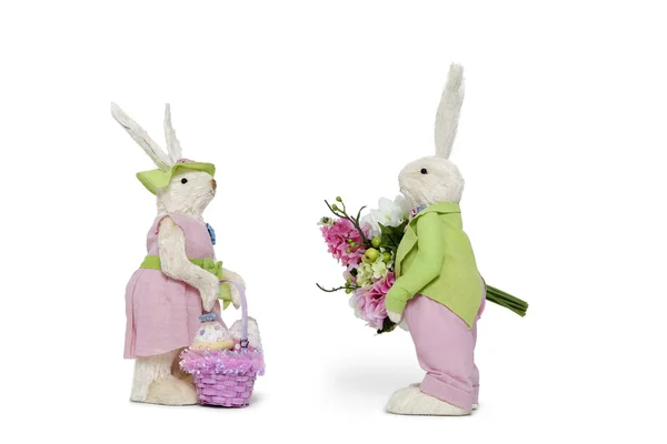 Side view of male Bunny with flower bouquet and female Rabbit over white background — Stock Photo, Image