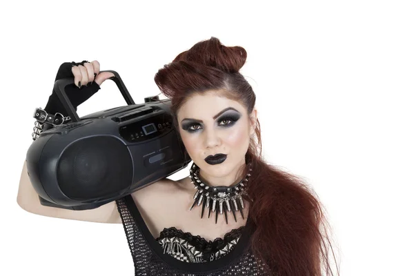 Portrait of punk woman holding boom box on shoulder over white background — Stock Photo, Image