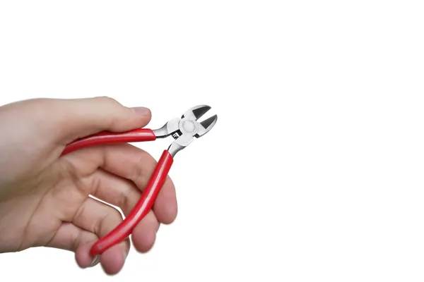 Cropped image of hand holding pliers over white background — Stock Photo, Image