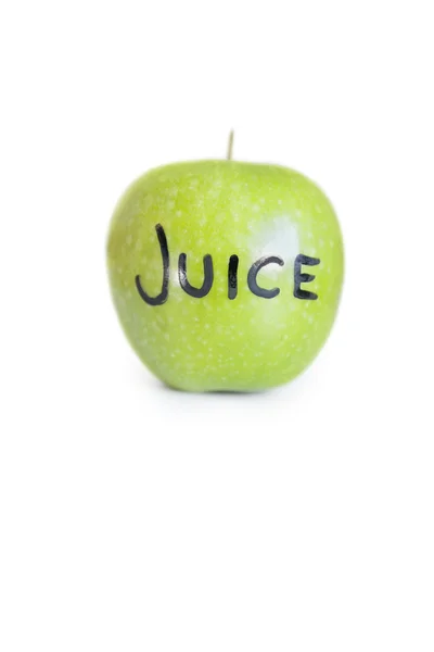 Close-up of text on a granny smith apple over white background — Stock Photo, Image