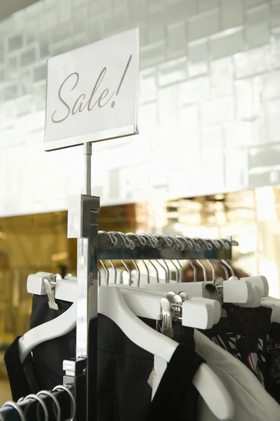 Clothes hanging on rack — Stock Photo, Image