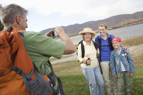Man Photographs Mother, Daughter And Granddaughter Lakeside — Stock Photo, Image