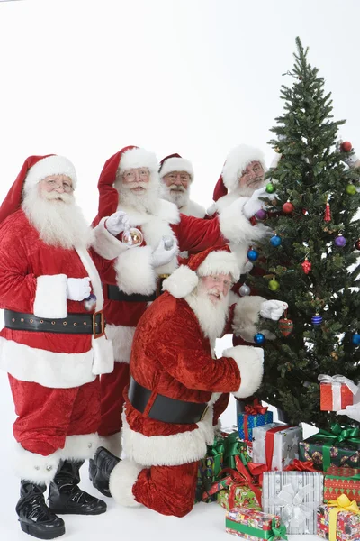 Santa Claus Outfits Decorating Christmas Tree — Stock Photo, Image