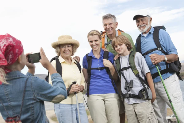 Girl Photographing Family Portrait Stock Photo