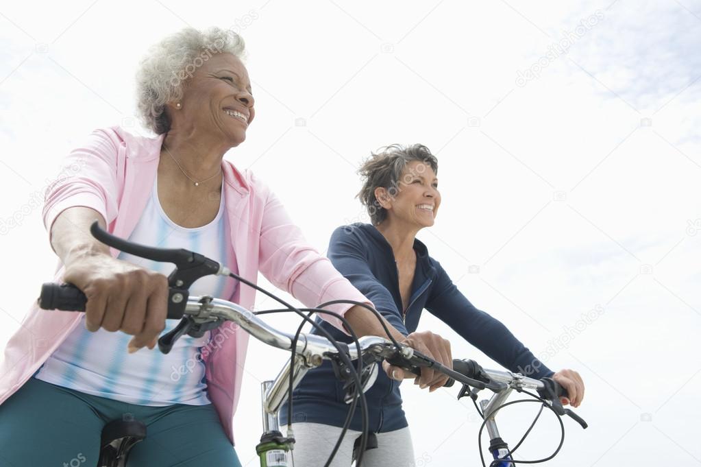 Senior Female Friends Riding Bicycles