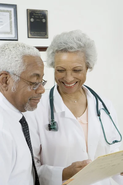 Doctors with Document In Clinic — Stock Photo, Image