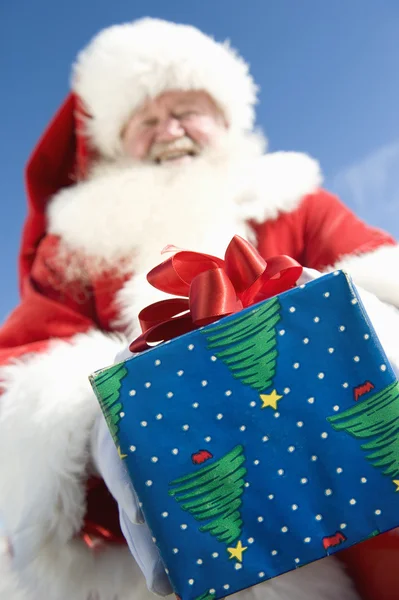 Santa Claus Giving A Present — Stock Photo, Image